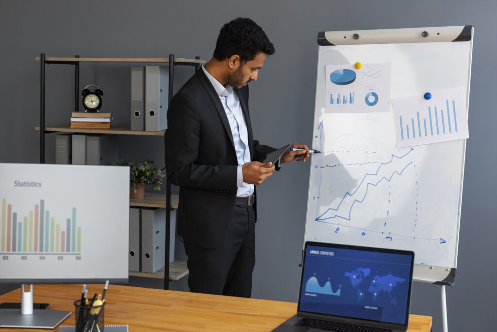 Business Person Looking Finance Graphs 1024x683