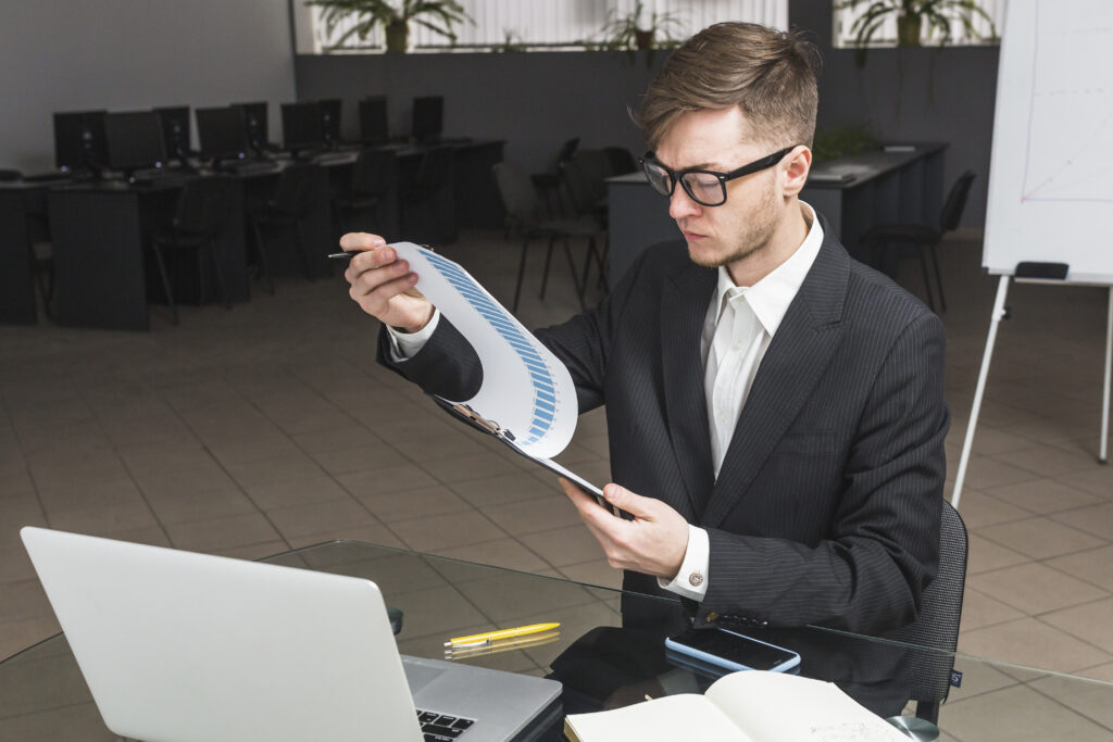Businessman Analyzing Graph Office 1024x683
